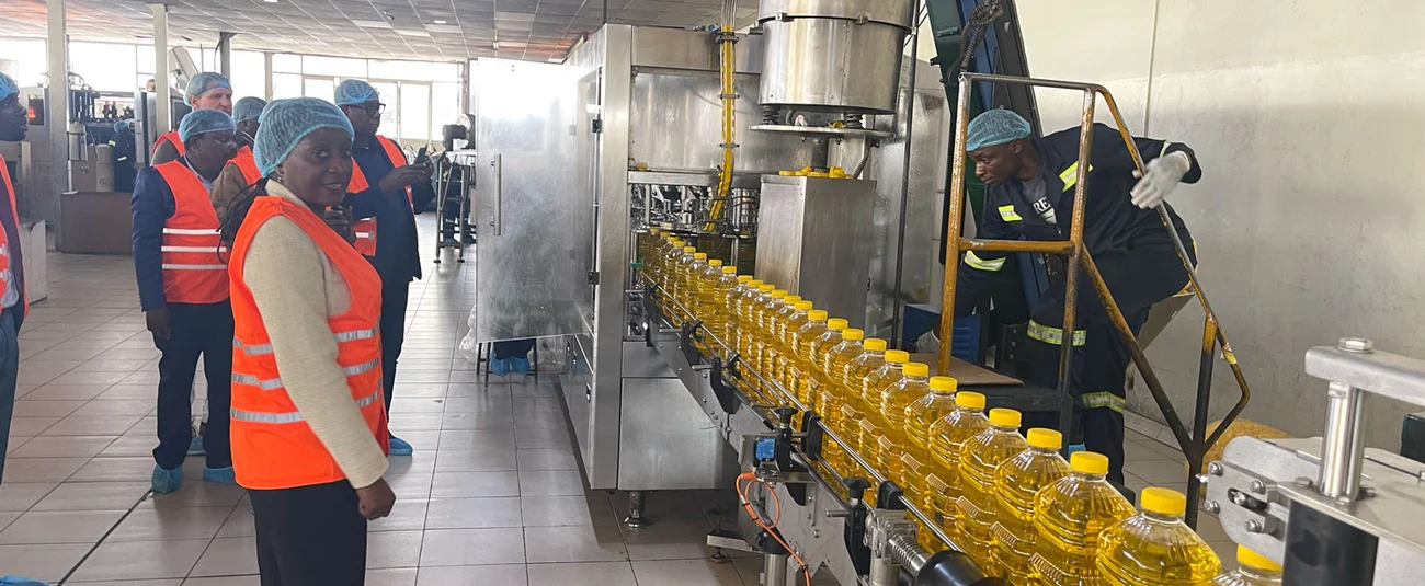 Senior Bank officials during a visit to a vegetable oil production facility in Zimbabwe.